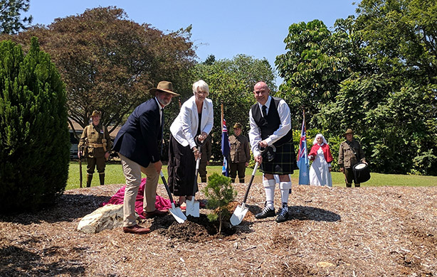 Planting a tree in memory of local servicemen at Rockhampton Botanic Gardens