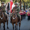 First World War replica uniforms and horses on display during the march.