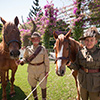 Army personnel with their horses.